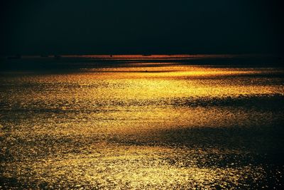 Scenic view of sea against sky at night