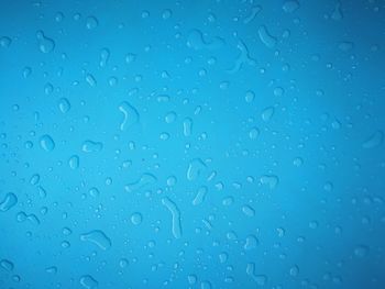 Full frame shot of wet glass window