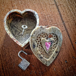 Heart shape made of bread on wood