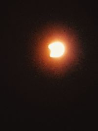 Low angle view of illuminated orange sun