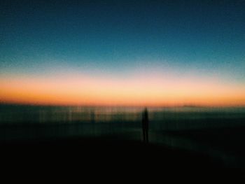 Silhouette of people at sunset