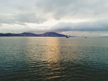 Scenic view of sea against cloudy sky