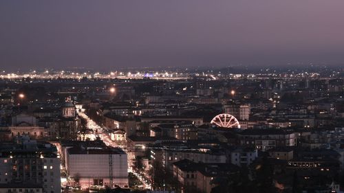 High angle view of illuminated buildings in city