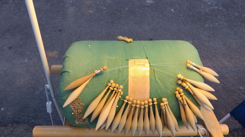 High angle view of bobbin lace on street