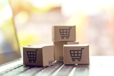 Close-up of information sign on table