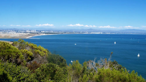 High angle view of sea against blue sky