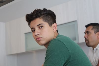 Close-up of portrait of young man at home