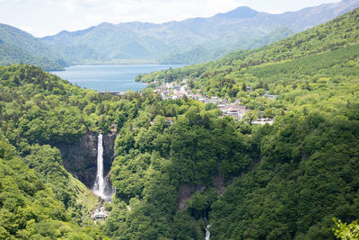 Lake chuzenji and waterfall surrounded by trees