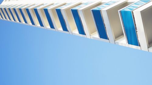 Low angle view of building against clear blue sky