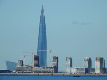 Low angle view of skyscrapers against clear sky