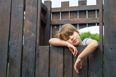 Portrait of girl at wooden play equipment