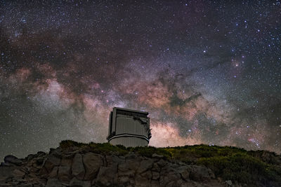 Built structure against sky at night