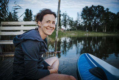 Smiling woman at lake