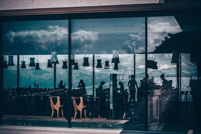 Reflection of sky on glass window at restaurant 