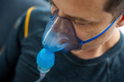 Close-up of man wearing mask