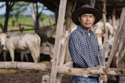 Portrait of man standing in farm