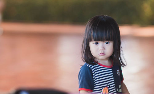 Portrait of girl standing outdoors