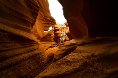 Low section of man standing on rock