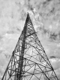 Low angle view of electricity pylon against sky