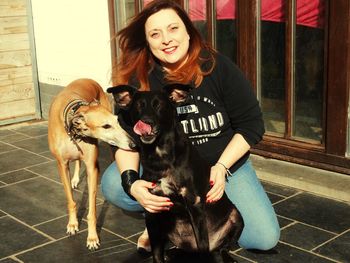 Portrait of woman with dogs