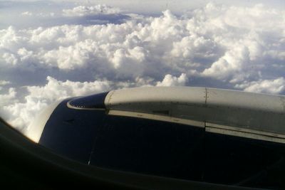 Cropped image of airplane on landscape