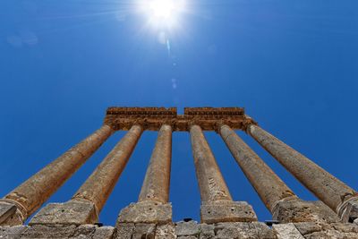 Low angle view of historical building against blue sky