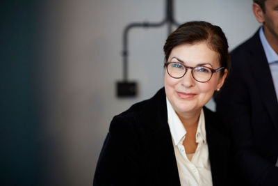 Portrait of confident mature businesswoman sitting in office