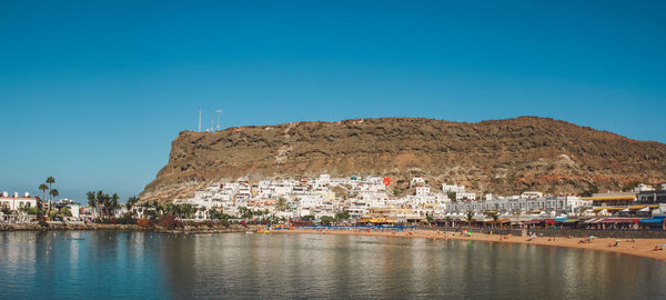View of town against blue sky