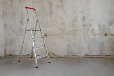 View of ladder against wall at home