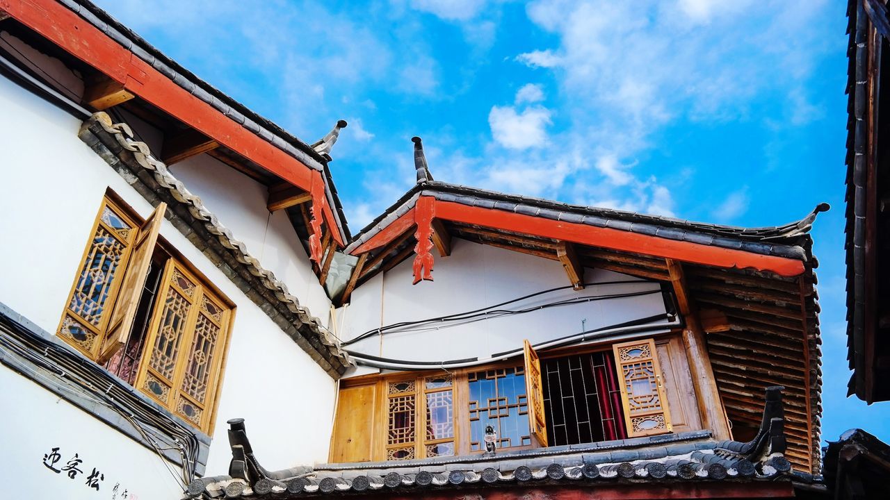 low angle view, architecture, built structure, building exterior, sky, window, cloud - sky, cloud, day, ornate, outdoors, no people, building, design, art and craft, architectural feature, facade, blue, high section, city