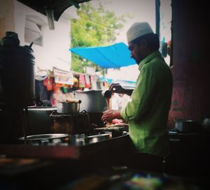 People working at market stall