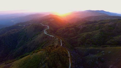 High angle view of mountains against sky during sunset