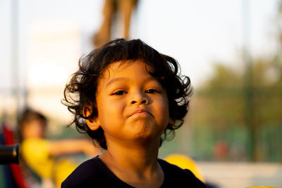 Portrait of cute boy outdoors