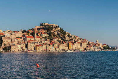 Scenic view of sea against clear blue sky