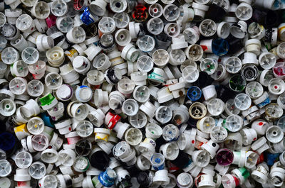 Full frame shot of abandoned spray bottle caps