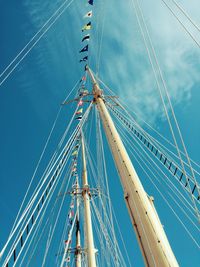 Low angle view of sailboat sailing against blue sky