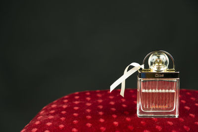 Close-up of christmas decoration on table against black background