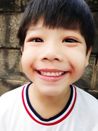 Close-up portrait of smiling boy