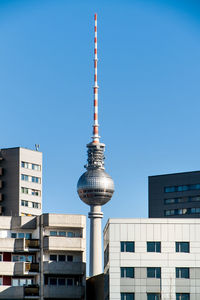 Low angle view of buildings against blue sky