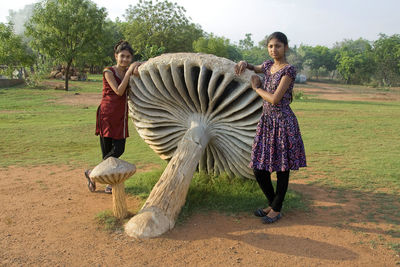 Full length of woman standing on field