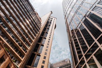 Bottom view of skyscrapers with large windows. toned in vintage warm colors.