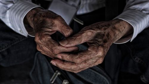 Close-up of man holding hands