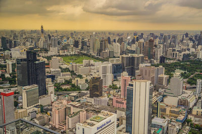 Aerial view of cityscape against sky during sunset