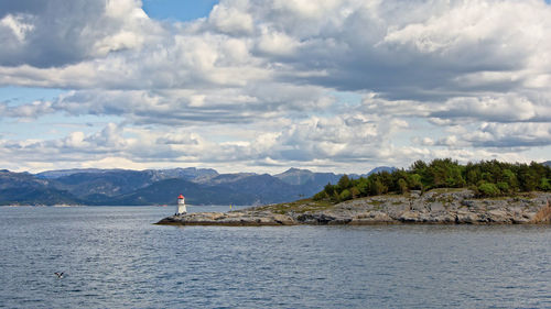 Scenic view of sea against cloudy sky