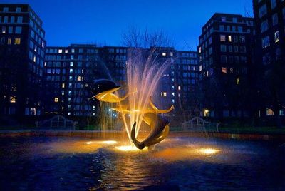 Illuminated buildings in city at night