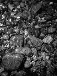 Full frame shot of rocks at sea shore