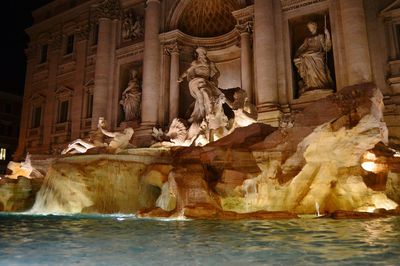 Statue in front of building