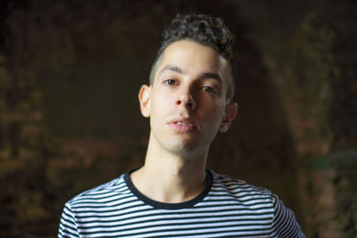 Close-up portrait of young man standing outdoors