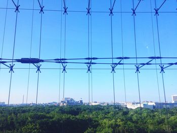 Electricity pylon against blue sky