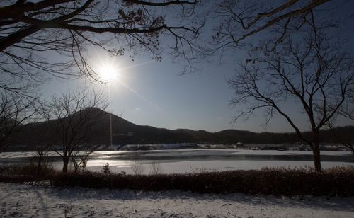 Scenic view of lake against sky during sunset